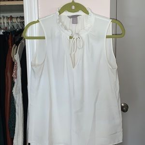 White sleeveless tie neck blouse